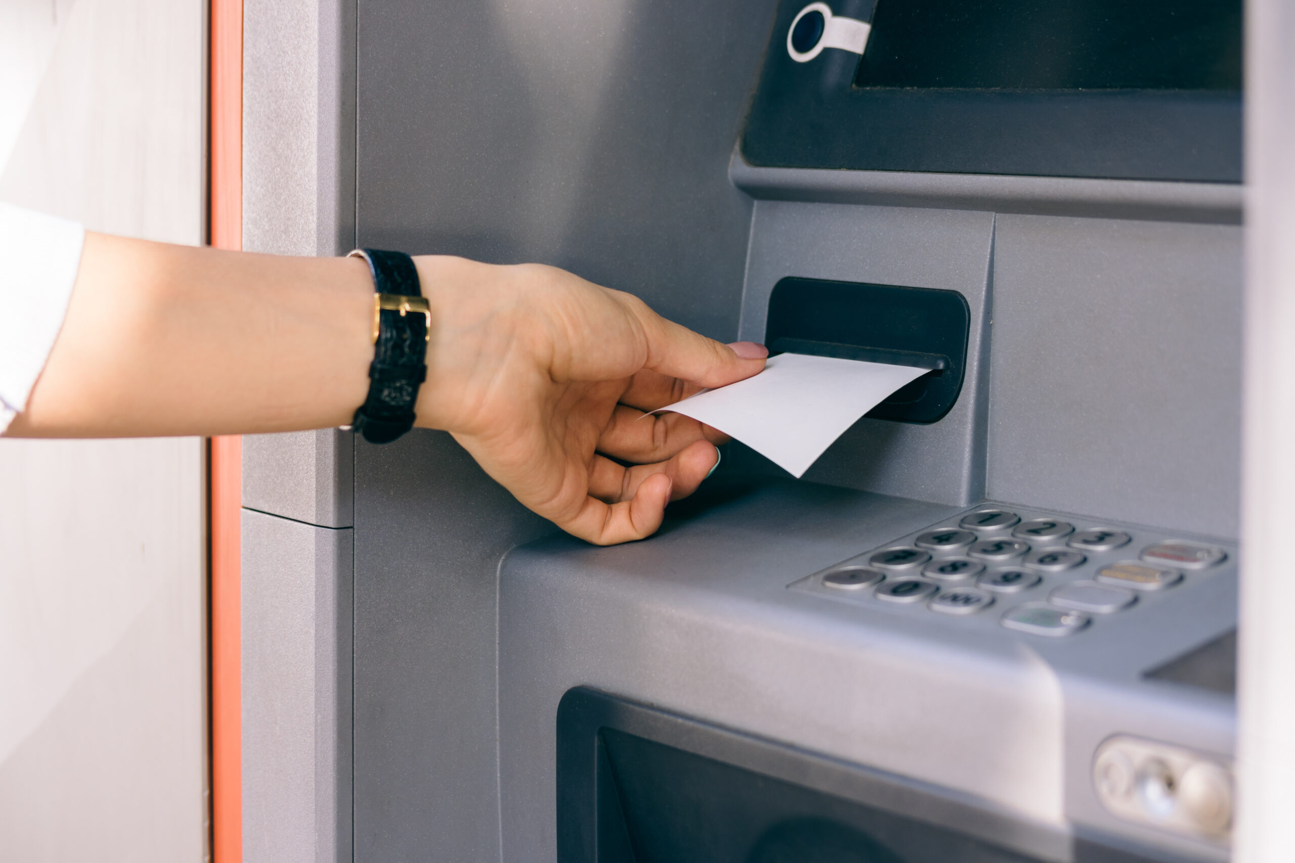 Person obtaining ATM receipt